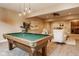 Aesthetic game room with pool table and seating area at 6640 E Deerfield Dr, Zionsville, IN 46077