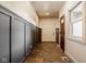 Entryway featuring stone floors, paneled walls and a view of the front door at 6640 E Deerfield Dr, Zionsville, IN 46077