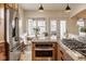Bright kitchen features granite countertops, stainless steel appliances, and a cozy breakfast nook with outside access at 6640 E Deerfield Dr, Zionsville, IN 46077
