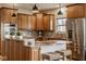 Kitchen boasts a granite island, stainless steel appliances, and barstool seating, with great counter space at 6640 E Deerfield Dr, Zionsville, IN 46077
