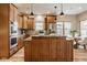 Kitchen featuring a spacious island, granite countertops, stainless steel appliances, and breakfast nook at 6640 E Deerfield Dr, Zionsville, IN 46077