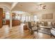 Open-concept living space with hardwood floors and seamless flow to kitchen and dining areas at 6640 E Deerfield Dr, Zionsville, IN 46077