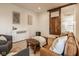 Comfortable living room with a sliding barn door, leather couch, and white storage cabinet at 6640 E Deerfield Dr, Zionsville, IN 46077