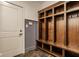Mudroom with built-in storage shelves and coat hooks at 6640 E Deerfield Dr, Zionsville, IN 46077
