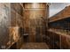 Tiled shower with built-in seat and shower head; pebble floor and a small window at 6640 E Deerfield Dr, Zionsville, IN 46077