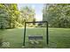 Relaxing backyard setting featuring a swing for enjoying peaceful moments in nature at 6688 Bellsville Pike, Columbus, IN 47201