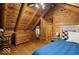 Charming bedroom features a rocking chair, wooden dresser, and a comfortable bed at 6688 Bellsville Pike, Columbus, IN 47201