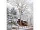 Winter view of log cabin with a gated yard and snow-covered trees at 6688 Bellsville Pike, Columbus, IN 47201