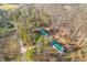 Aerial view of two green roof homes surrounded by trees at 7116 Grandview Rd, Columbus, IN 47201