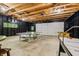 A spacious basement featuring a ping pong table, air hockey, and foosball for endless entertainment possibilities at 7116 Grandview Rd, Columbus, IN 47201