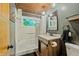 Charming bathroom with stained-glass window, modern vanity, and walk-in shower at 7116 Grandview Rd, Columbus, IN 47201