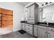 Stylish bathroom with gray cabinets, granite countertops, and tile flooring at 7116 Grandview Rd, Columbus, IN 47201