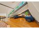 Bedroom featuring two twin beds, hardwood floors, and multiple windows at 7116 Grandview Rd, Columbus, IN 47201