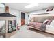 Basement bedroom with bunk beds, a playhouse and playful decor at 7116 Grandview Rd, Columbus, IN 47201