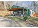 Inviting home exterior with a charming covered porch and well-manicured lawn at 7116 Grandview Rd, Columbus, IN 47201