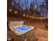 Outdoor hot tub under string lights at 7116 Grandview Rd, Columbus, IN 47201