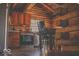 Rustic kitchen and dining area featuring log walls and modern appliances at 7116 Grandview Rd, Columbus, IN 47201