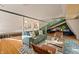 Open concept living area with light-filled windows and a comfortable green couch at 7116 Grandview Rd, Columbus, IN 47201