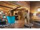 Spacious living room with log walls, fireplace, and open floor plan at 7116 Grandview Rd, Columbus, IN 47201