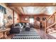 Inviting living room featuring wood paneling, a comfortable seating area, and stylish decor at 7116 Grandview Rd, Columbus, IN 47201