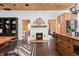 Open concept living space with a fireplace, black built-ins, and wood floors at 7116 Grandview Rd, Columbus, IN 47201