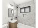 Modern bathroom features stylish tile, a sleek vanity, and updated fixtures at 714 S 4Th Ave, Beech Grove, IN 46107