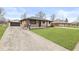Charming brick home with concrete driveway and well-maintained landscaping at 714 S 4Th Ave, Beech Grove, IN 46107