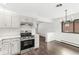 Kitchen featuring stainless steel appliances and hardwood floors, perfect for cooking and entertaining at 714 S 4Th Ave, Beech Grove, IN 46107