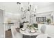 Bright kitchen features updated appliances, white cabinetry, and a cozy dining area at 714 S 4Th Ave, Beech Grove, IN 46107