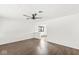 Bright, spacious living room with wood floors and a ceiling fan at 714 S 4Th Ave, Beech Grove, IN 46107