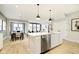 Spacious eat-in kitchen featuring a stainless steel dishwasher and a center island with a stainless steel sink at 7346 Shroyer Way, Noblesville, IN 46062