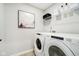 Well-lit laundry room featuring modern washer and dryer, practical storage, and neutral tones for a clean and efficient space at 7346 Shroyer Way, Noblesville, IN 46062