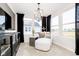 Bright and airy sitting room with stylish chaise lounge, modern lighting, and neighborhood views, perfect for relaxation at 7346 Shroyer Way, Noblesville, IN 46062