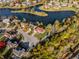 Panoramic aerial view of neighborhood with lake and colorful autumn foliage at 7370 Chestnut Hills Blvd, Indianapolis, IN 46278