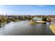 Scenic aerial shot capturing a tranquil lake neighborhood, displaying the serene environment and attractive properties at 7370 Chestnut Hills Blvd, Indianapolis, IN 46278