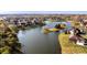 Breathtaking aerial view of a lakeside community with lush green lawns, mature trees, and beautiful homes at 7370 Chestnut Hills Blvd, Indianapolis, IN 46278