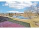 Lush backyard bordering a tranquil lake offers serene views and a peaceful escape at 7370 Chestnut Hills Blvd, Indianapolis, IN 46278