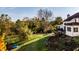 Landscaped backyard with upper deck and lush greenery at 7370 Chestnut Hills Blvd, Indianapolis, IN 46278