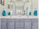 Bathroom featuring double sinks, vanity, and large mirror at 7370 Chestnut Hills Blvd, Indianapolis, IN 46278