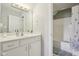 Bathroom with white vanity, mirror, and tub with shower at 7370 Chestnut Hills Blvd, Indianapolis, IN 46278