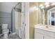Bathroom with white vanity, mirror, and toilet at 7370 Chestnut Hills Blvd, Indianapolis, IN 46278