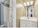 Bathroom with white vanity and tub with shower at 7370 Chestnut Hills Blvd, Indianapolis, IN 46278