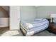 Bedroom featuring a comfortable bed, bedside table, and light walls at 7370 Chestnut Hills Blvd, Indianapolis, IN 46278