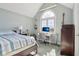 Bedroom featuring an arched window, a desk, and a comfortable bed at 7370 Chestnut Hills Blvd, Indianapolis, IN 46278