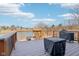 Scenic deck overlooking the water featuring a built-in grill and outdoor furniture at 7370 Chestnut Hills Blvd, Indianapolis, IN 46278