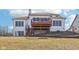 Rear view of the home showcasing the deck and backyard at 7370 Chestnut Hills Blvd, Indianapolis, IN 46278