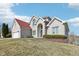 Charming two-story home features a brick facade, attached two car garage, and manicured lawn at 7370 Chestnut Hills Blvd, Indianapolis, IN 46278
