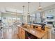 Bright, open kitchen features granite countertops, stainless steel appliances, and a view of the living room at 7370 Chestnut Hills Blvd, Indianapolis, IN 46278