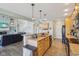 Spacious kitchen with a central island, wood cabinets, and direct access to the living room and stairs at 7370 Chestnut Hills Blvd, Indianapolis, IN 46278