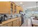 A well-appointed kitchen features light wood cabinets, granite countertops, and a cozy breakfast nook at 7370 Chestnut Hills Blvd, Indianapolis, IN 46278